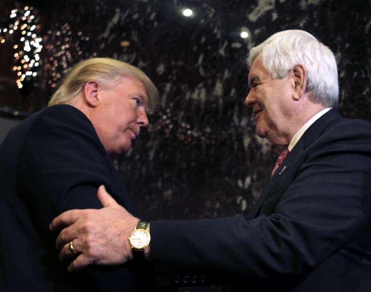 Republican presidential candidate, former House Speaker Newt Gingrich and Donald Trump shake hands after they met and spoke to the media in New York, Monday, Dec. 5, 2011.