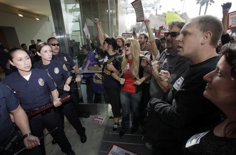 Student demonstrators are confronted by California State University Police officers during a protest Wednesday Nov. 16, 2011