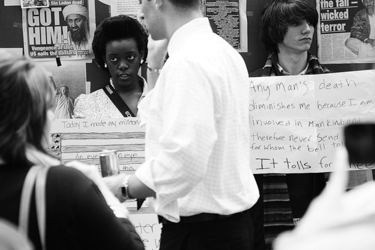 Two youths hold posters at the WTC.