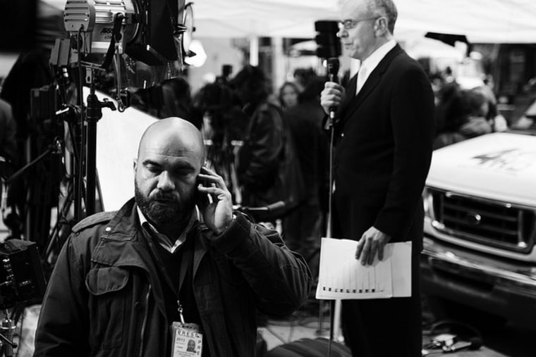 A TV reporter broadcasts from the WTC.