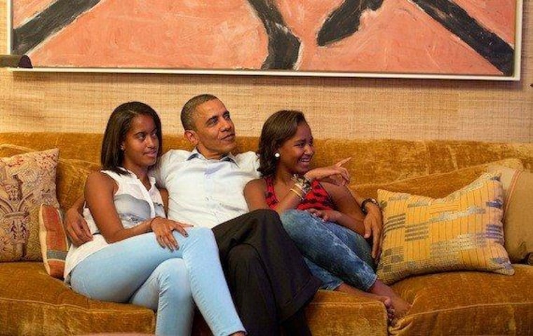 President Obama watches Mrs. Obama's DNC address on television from the White House with daughters Malia (left) and Sasha
