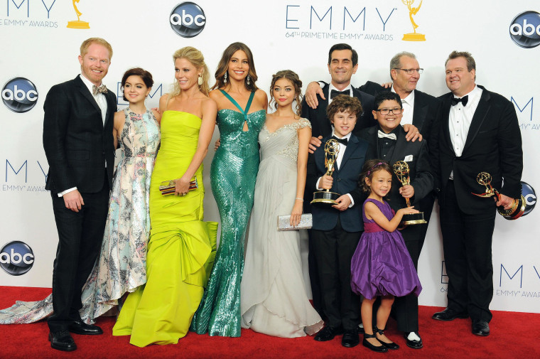 The cast of \"Modern Family\", from left, Jesse Tyler Ferguson, Ariel Winter, Julie Bowen, Sofía Vergara, Sarah Hyland , Ty Burrell, background, Nolan Gould, Ed O'Neill, background second left, Rico Rodriguez, Aubrey Anderson-Emmons, foreground purple...