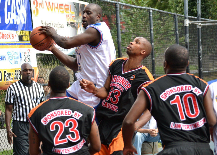\"Go Get It\" driving to the hoop in the 7th Gardiner Memorial Classic