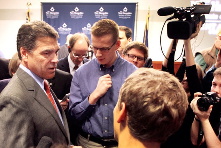 Republican presidential candidate Rick Perry meeting with students after speaking at St. Anselm's College in Manchester, New Hampshire.