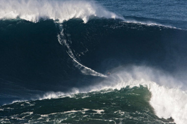 Garrett \"G-Mac\" McNamara surfs nearly 90 feet of wave