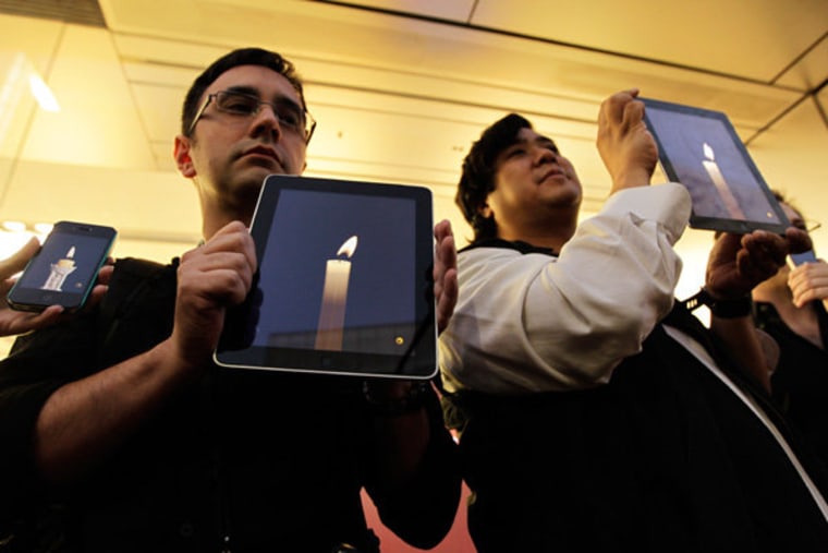 An iPad candlelight vigil in honor of Steve Jobs.