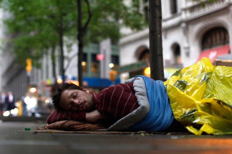 An Occupy Wall Street demonstrator sleeping on the sidewalk in Zuccotti Park in New York on Wednesday, September 28.