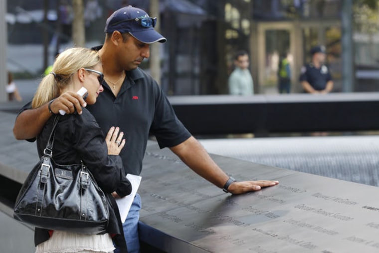 Shauna Camp and Anthony Camp checking out the 9/11 memorial on Monday. They lost their uncle Faustino Apostol Jr. in the attacks.