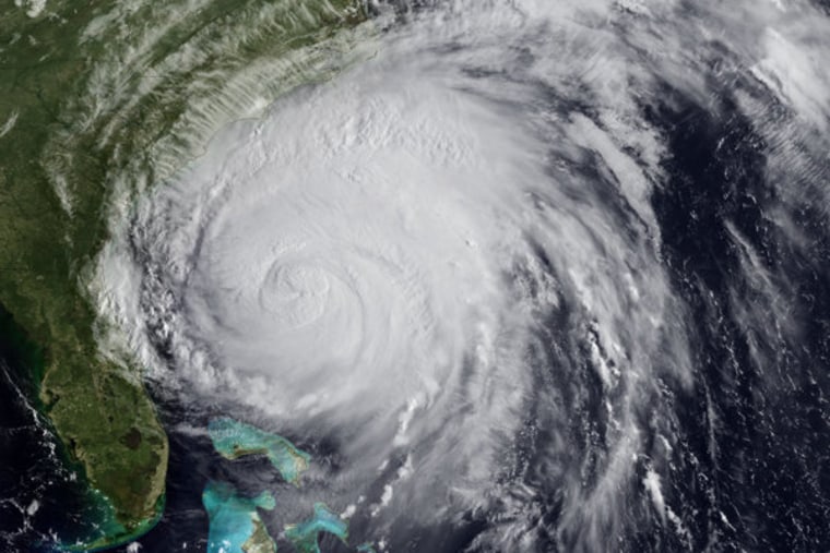 Satellite image of Hurricane Irene churning near the coastline on Friday.