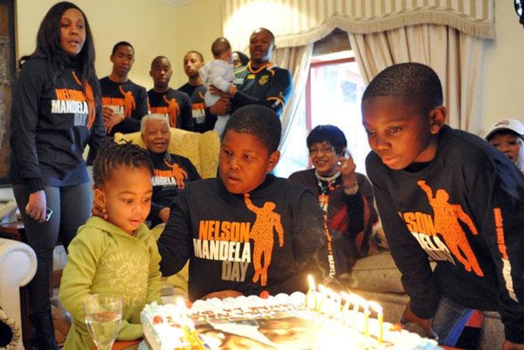 Nelson Mandela surrounded by family members in Qunu, South Africa on Monday.