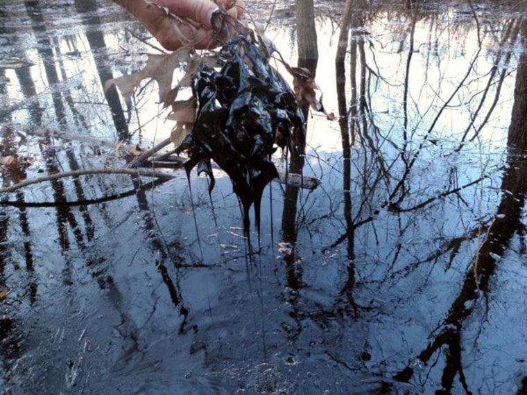 Oil in creek approx, 0.25 miles east of I-40, west of cove. 3/31/2013