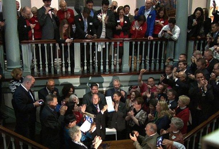 Delaware Gov. Jack Markell signs his state's marriage equality bill into law on the steps of Legislative Hall in Dover.