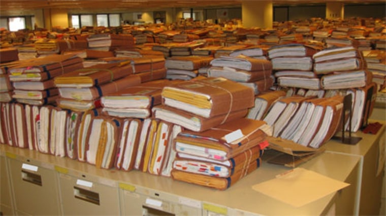 Stacks of Veterans Affairs claim folders at a regional office in Winston-Salem, N.C.