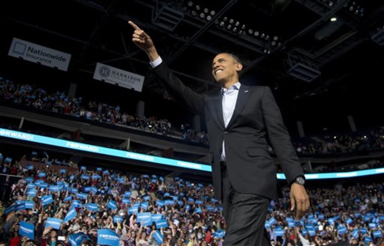 President Barack Obama points to the crowd as he arrives to speak at a campaign event at Nationwide Arena, Monday, Nov. 5, 2012, in Columbus, Ohio.  (AP Photo/Carolyn Kaster)