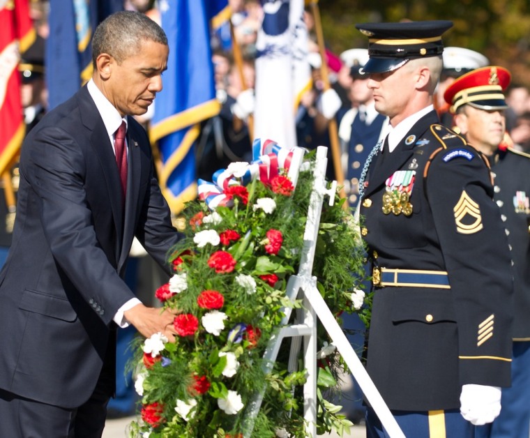 US President Barack Obama lays a wreath during a Veterans' Day ceremony at Arlington National Cemetery in Arlington, Virginia, on November 11, 2012. (AFP PHOTO/Nicholas KAMMNICHOLAS KAMM/AFP/Getty Images)