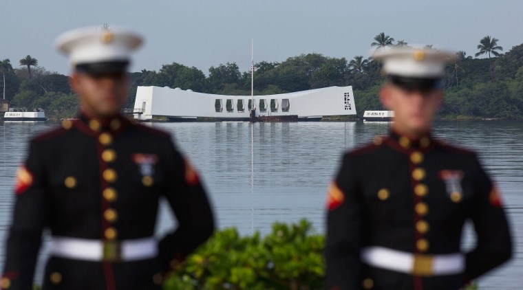 PEARL HARBOR, HAWAII - DECEMBER 7:   A U.S. Marine firing detail stands at attention with the Arizona Memorial in background during the 71st Annual Memorial Ceremony commemorating the WWII Attack On Pearl Harbor at the World War 2 Valor in the Pacific...