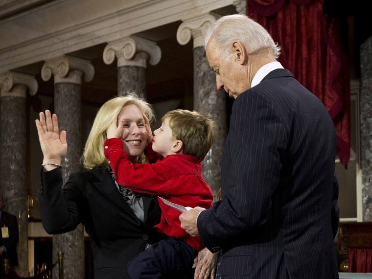 Henry Gillibrand plays with the hair of his mother, Sen. Kirsten Gillibrand, D-N.Y. as she participates in a mock swearing-in ceremony for the 113th Congress with Vice President Joe Biden, Thursday, Jan. 3, 2013, in the Old Senate Chamber on Capitol...