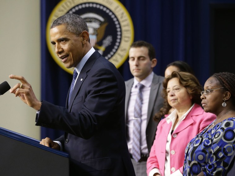 On the final day before the U.S. was to go over the so-called fiscal cliff, President Barack Obama addressed the nation, flanked by 14 middle class Americans, for his pitch ostensibly on their behalf on tax rate negotiations. (AP Photo/Charles Dharapak)