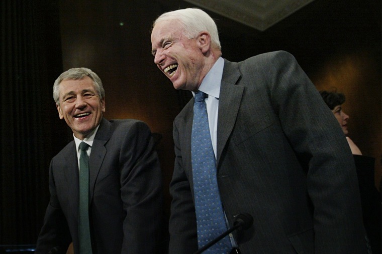 Chuck Hagel, center, R-Neb, and John McCain, right, R-Ariz, share a laugh on the Capitol Hill, Thursday, Feb. 12, 2004 in Washington.   (Photo by Manuel Balce Ceneta/AP)