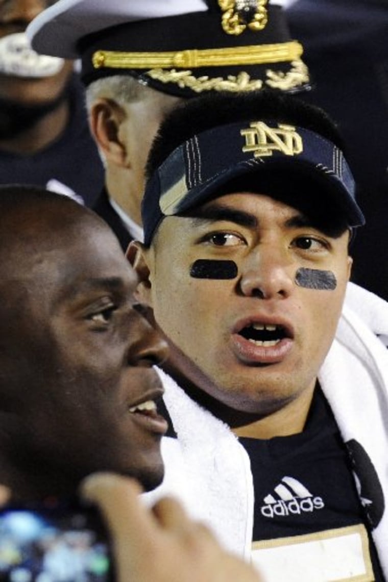 In this Nov. 17, 2012, photo, Notre Dame linebacker Manti Te'o sings the alma mater following their NCAA college football game against Stanford in South Bend, Ind. A story that Te'o's girlfriend had died of leukemia _ a loss he said inspired him to...
