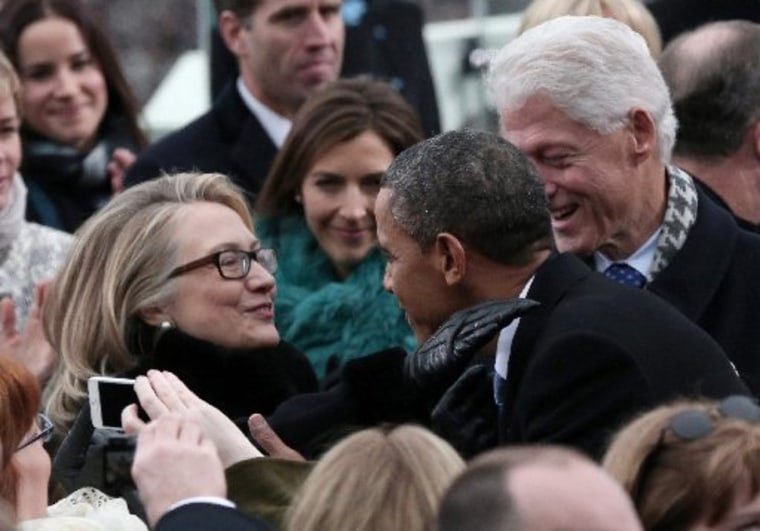 U.S. President Barack Obama greets Secretary of State Hillary Clinton and former President Bill Clinton during the presidential inauguration on the West Front of the U.S. Capitol in Washington January 21, 2013.   REUTERS/Win McNamee/Pool (UNITED STATES...