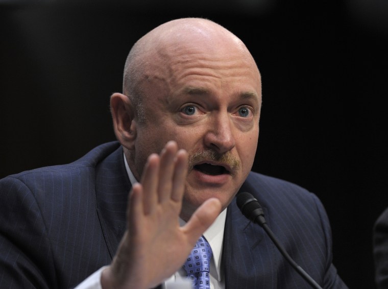 Mark Kelly, husband of former Arizona Rep. Gabrielle Giffords, who was seriously injured in the mass shooting that killed six people in Tucson, Ariz. two years ago, testifies on Capitol Hill in Washington, Wednesday, Jan. 30, 2013, before the Senate...