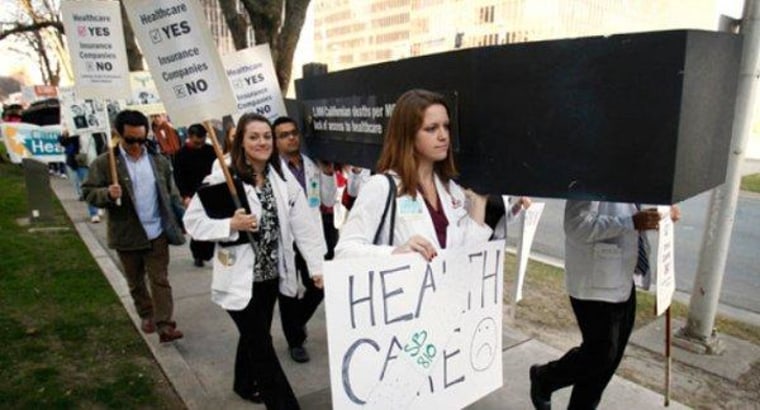 University of Southern California medical students carry a mock coffin in a 2012 protest to call attention to Americans who die because they lack sufficient health care coverage.