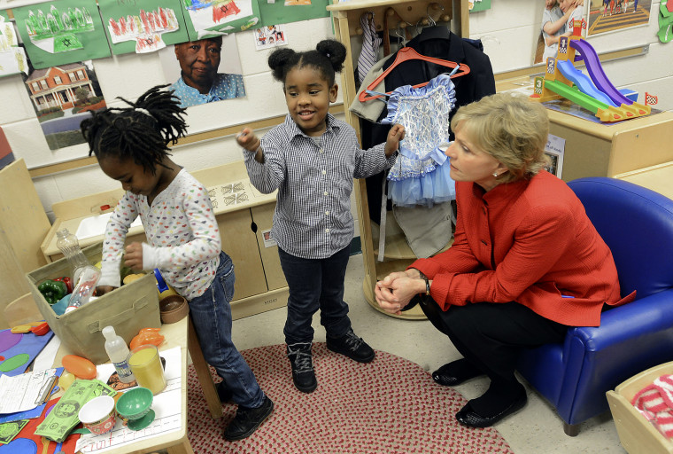 Gov. Bev Perdue, right, listens to Amaya Bryant and Jalynn Brandon, left,  Monday, Dec. 10, 2012, at Primary Colors Early Learning Center in Durham, N.C. Perdue visited the Pre-K classes to highlight the importance of preschool. (AP Photo/The Herald...