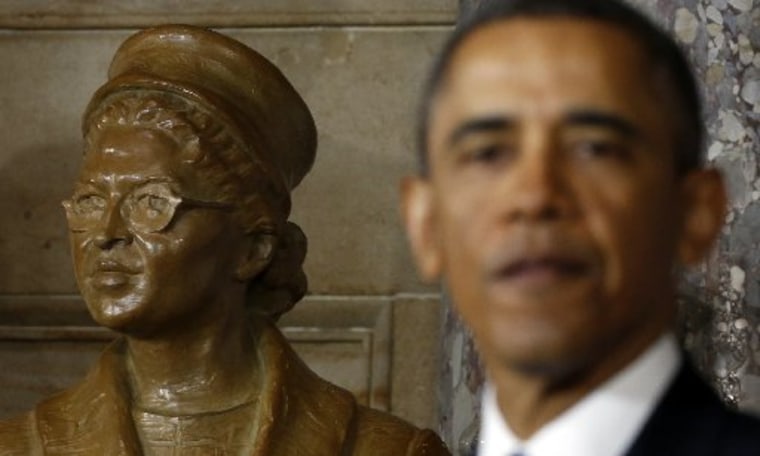 U.S. President Barack Obama speaks during the unveiling ceremony for the Rosa Parks statue (L) in the U.S. Capitol in Washington February 27, 2013. (Reuters/Kevin Lamarque)