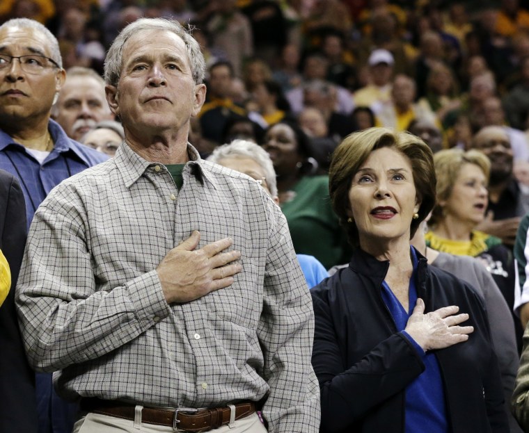 From left, Baylor President Ken Starr, former President George W. Bush and his wife Laura stand during the playing of the national anthem before a second-round game against Florida State in the women's NCAA college basketball tournament, Tuesday, March...