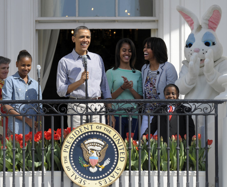 President Obama, accompanied by Michelle Obama, daughters Sasha and Malia, the Easter Bunny and Robby Novak, the Kid President, speak to the crowd during the annual Easter Egg Roll. (AP Photo/Susan Walsh)