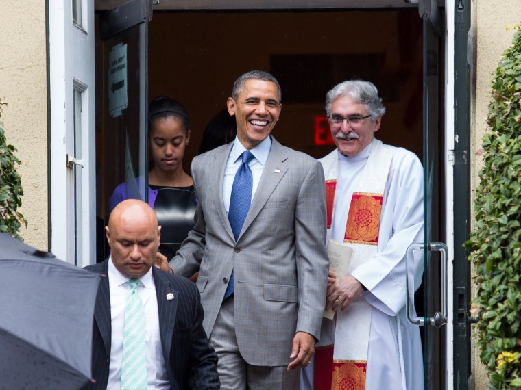 Reverend Dr. Luis Leon (R) looks on as United States President Barack Obama (C) prepares to leave St John's Episcopal Church after an Easter service, in Washington, 31 March 2013. Photo by: Drew Angerer/picture-alliance/dpa/AP Images
