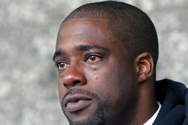 FILE - This May 24, 2012 file photo shows Brian Banks weeping after his rape conviction was dismissed in court, in Long Beach, Calif. Banks has signed with the Atlanta Falcons after the former Southern Cal recruit's football dream was derailed when he...