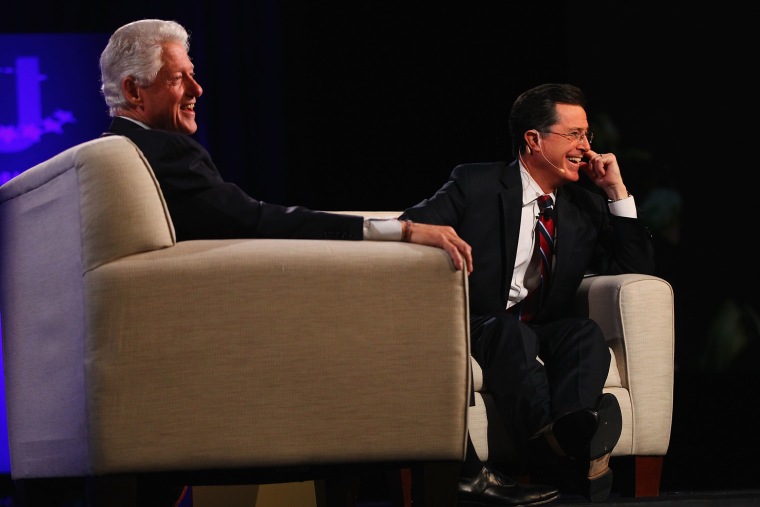 Former President Bill Clinton and TV personality Stephen Colbert take questions from the audience during the Clinton Global Initiative University at Washington University on April 6, 2013 in St Louis Missouri. (Photo by Dilip Vishwanat/Getty Images)
