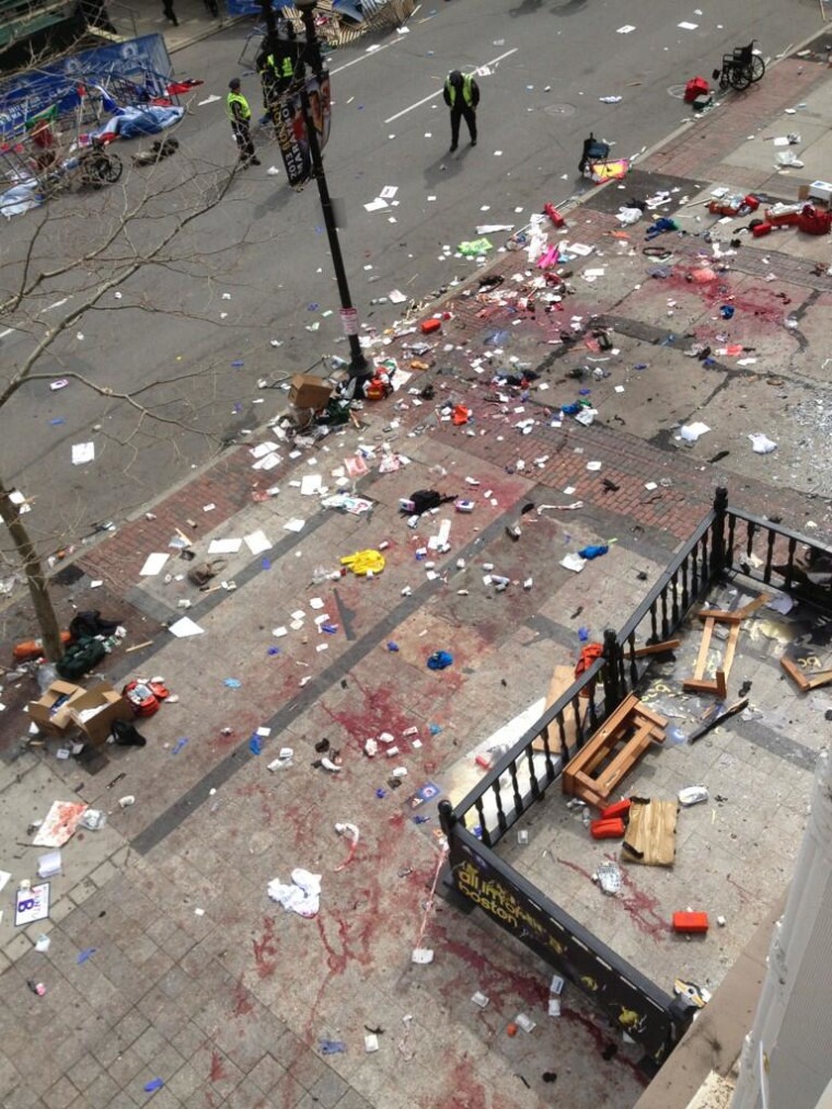 This photo provided by Bruce Mendelsohn shows the scene after two explosions occurred during the 2013 Boston Marathon in Boston, Monday, April 15, 2013. Two explosions shattered the euphoria of the Boston Marathon finish line on Monday, sending...