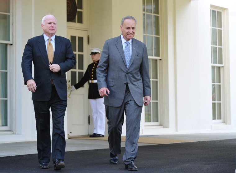 Senator Chuck Schumer (L), D-NY,  and Senator John McCain, R-AZ, make their way to speak to reporters outside of the West Wing following a meeting with US President Barack Obama to brief him on the draft of a bipartisan immigration reform bill at the...
