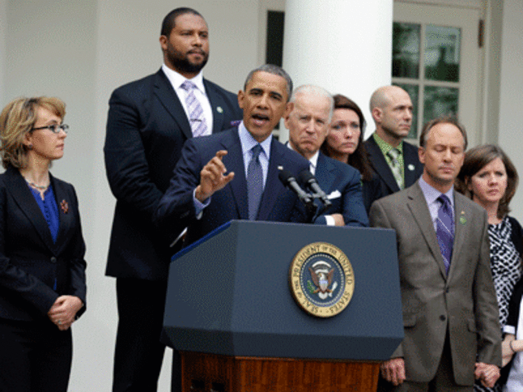 President Obama gestures  speaking during a news conference in the Rose Garden of the White House on April 17, 2013 alongside former Rep. Gabby Giffords, Vice President  Biden, and Newtown family members from left; Jimmy Greene, father of Ana; Nicole...