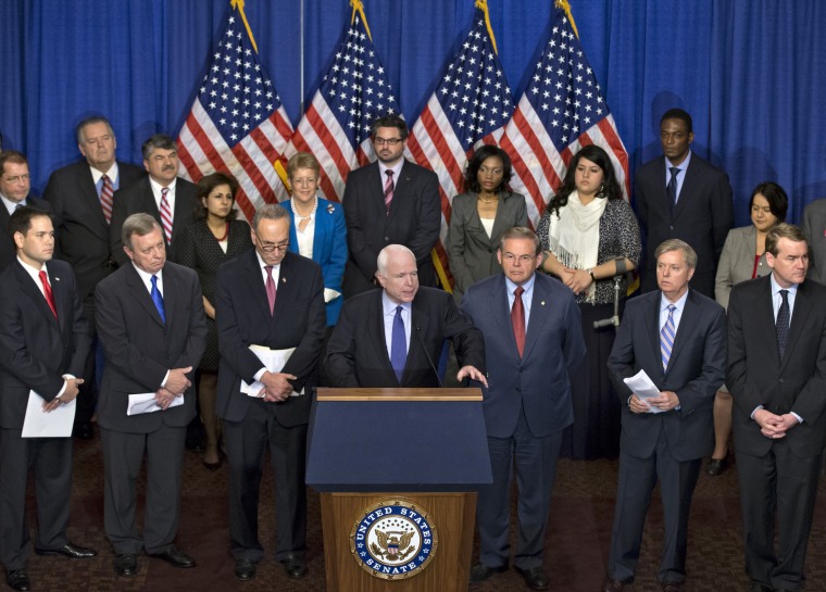 Sen. John McCain, R-Ariz., center, speaks as immigration reform legislation as outlined by the Senate's bipartisan \"Gang of Eight\" that would create a path for the nation's 11 million unauthorized immigrants to apply for U.S. citizenship, Thursday,...