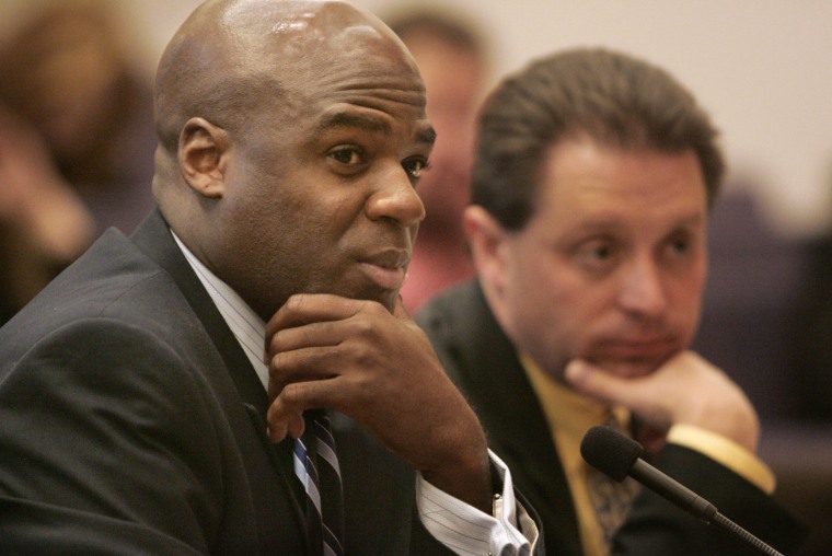 Nevada Assemblyman Kelvin Atkinson, D-North Las Vegas, left, listens during a joint transportation hearing Friday, June 1, 2007, at the Legislature in Carson City, Nev. (AP Photo/The Nevada Appeal, Cathleen Allison)