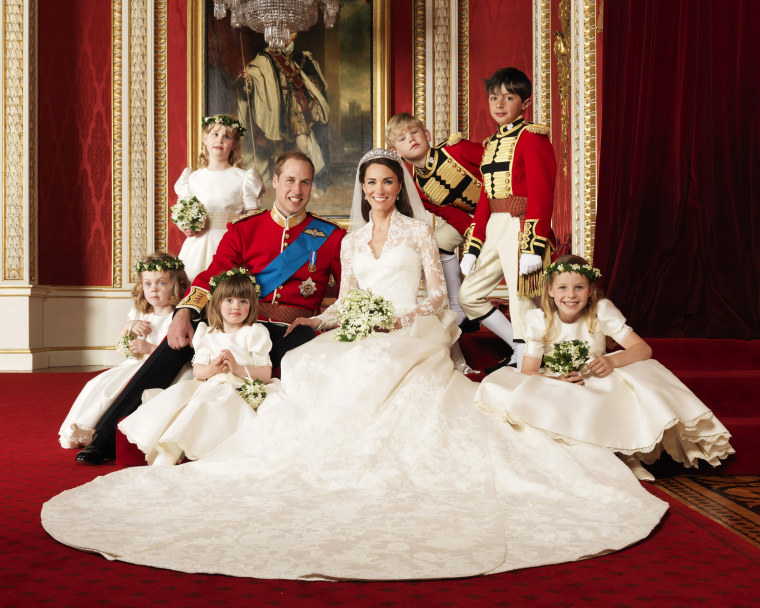 In this photo provided by Clarence House on Saturday, April 30, 2011, Britain's Prince William, center left, and his wife Kate, Duchess of Cambridge, center right, pose for a photograph with, clockwise from bottom right, Margarita Armstrong-Jones,...