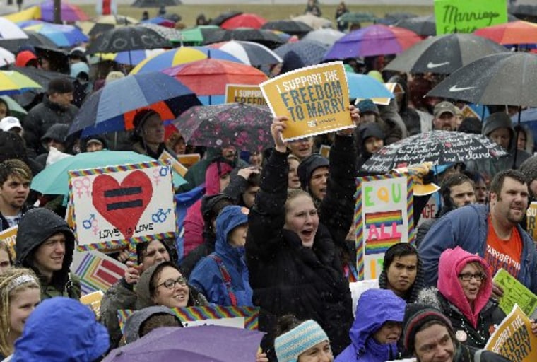 Hundreds turned out to brave rain, ice pellets and snow during a rally in support of a bill to legalize gay marriage at the Minnesota State Capitol, Thursday, April 18, 2013 in St. Paul, Minn.  Gov. Mark Dayton told the crowd he hoped legislators pass...