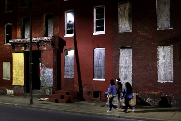 Baltimore is just one of the cities suffering with near-record levels of poverty. (Photo by Patrick Semansky/AP Photo)