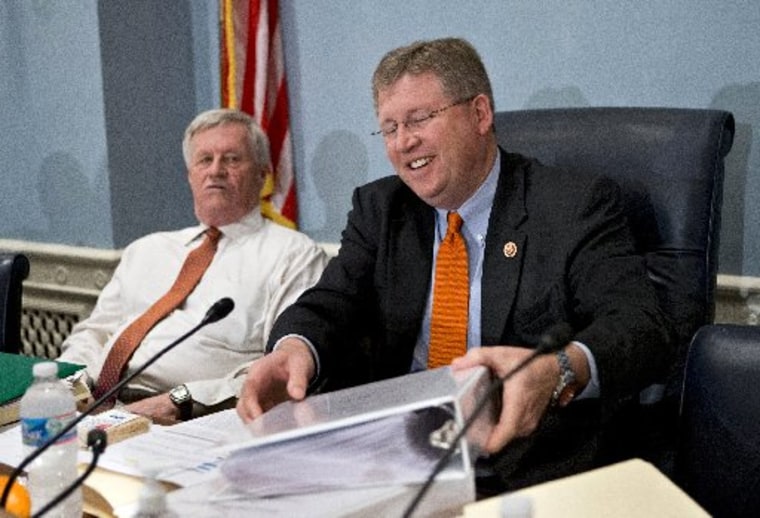 House Agriculture Committee Chairman Rep. Frank Lucas, R-Okla., right, accompanied by the committee's ranking Democrat, Rep. Collin Peterson, D-Minn., digs into paperwork as the panel meets to consider proposals to the 2013 Farm Bill. (AP Photo/J....