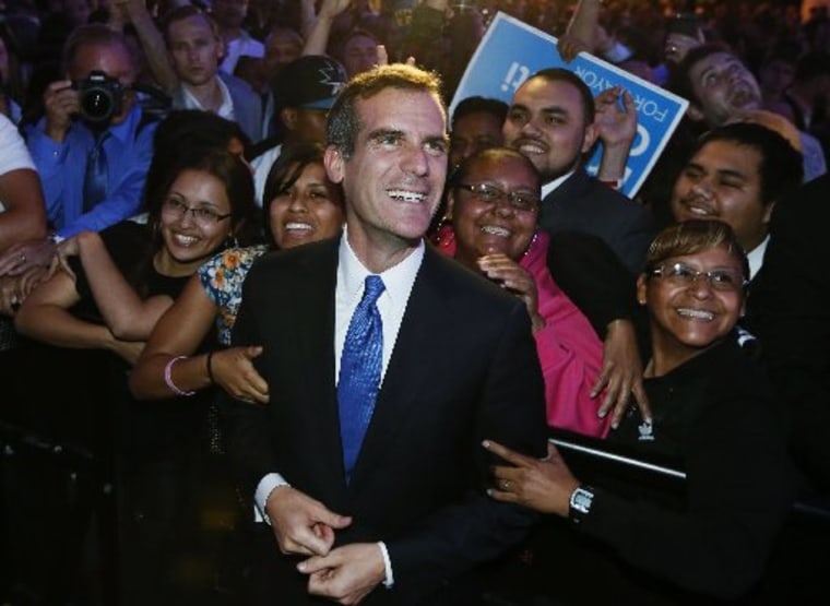 Los Angeles Mayor Eric Garcetti with supporters at an election night party at the Hollywood Palladium in Hollywood, California, May 21, 2013. (Photo by: Lucy Nicholson/Reuters).