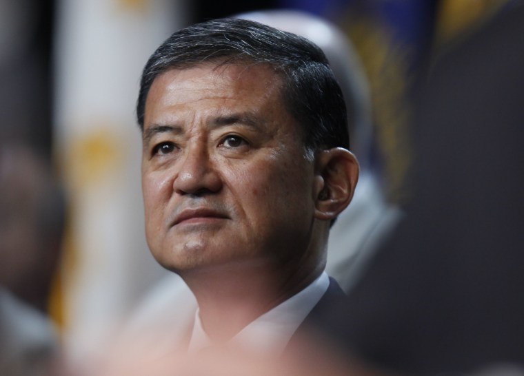 In this photo taken Aug. 2, 2010, Veterans Affairs Secretary Eric Shinseki listens to President Barack Obama speak about Iraq and Afghanistan at the Disabled American Veterans national convention in Atlanta. (AP Photo/Charles Dharapak)