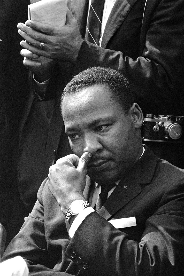 Dr. Martin Luther King Jr., Atlanta integration leader, touches his nose as he ponders a question during a news conference in Birmingham, Alabama, Sept. 16, 1963. King said he and other leaders have called for federal Army occupation of Birmingham,...