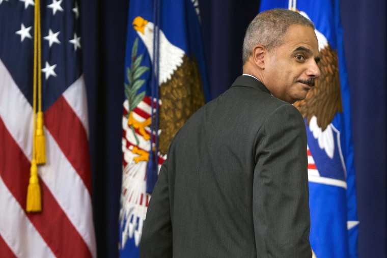 Attorney General Eric Holder glances back at invited guests while leaving after speaking during the Office of Inspector Generals annual awards ceremony, Wednesday, May 29, 2013, at the Justice Department in Washington.   (AP Photo/Manuel Balce Ceneta)