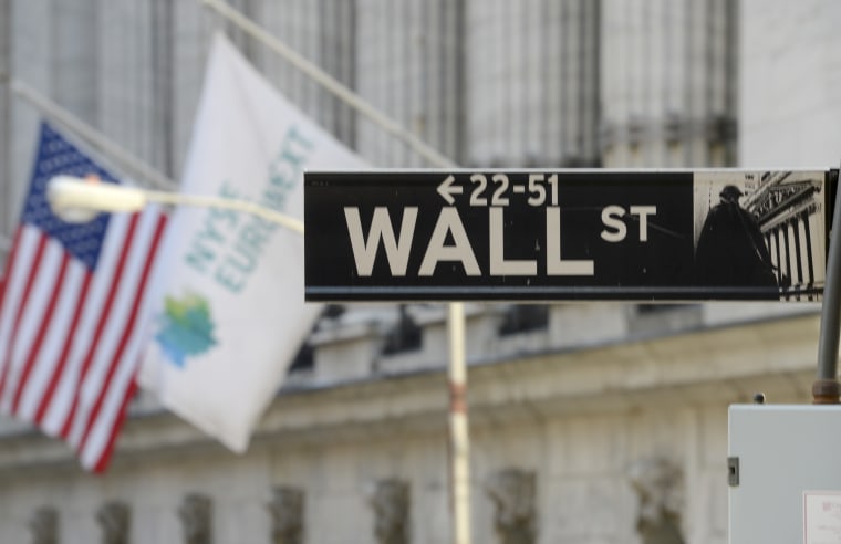 This Wednesday, Feb. 13, 2013 photo shows the Wall St. sign in New York. (AP Photo/Henny Ray Abrams)