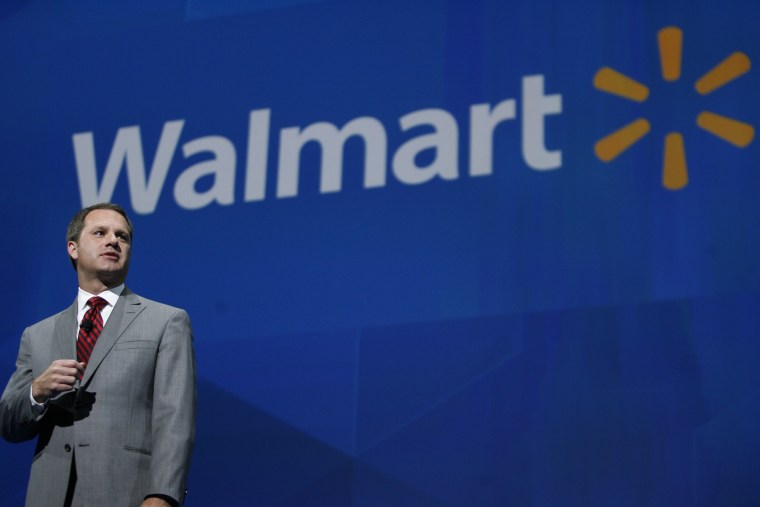 President and CEO, Walmart International Doug McMillan addresses the crowd on Wal-Mart 's 2012 worldwide sales during the Walmart shareholders meeting in Fayetteville, Ark., Friday, June 7, 2013. (AP Photo/Gareth Patterson)