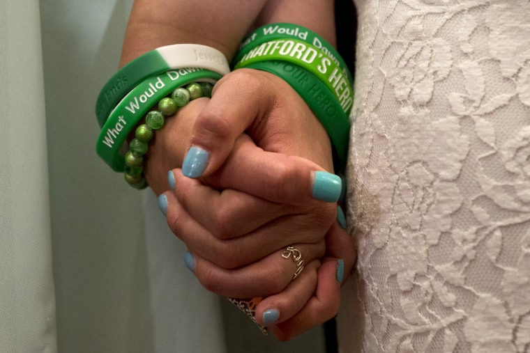 Jillian Soto, left, and Carlee Soto, sisters of Newtown, Conn. shooting victim Victoria Soto, hold hands during a news conference on Capitol Hill in Washington, Thursday, June 13, 2013,  (AP Photo/Jacquelyn Martin)